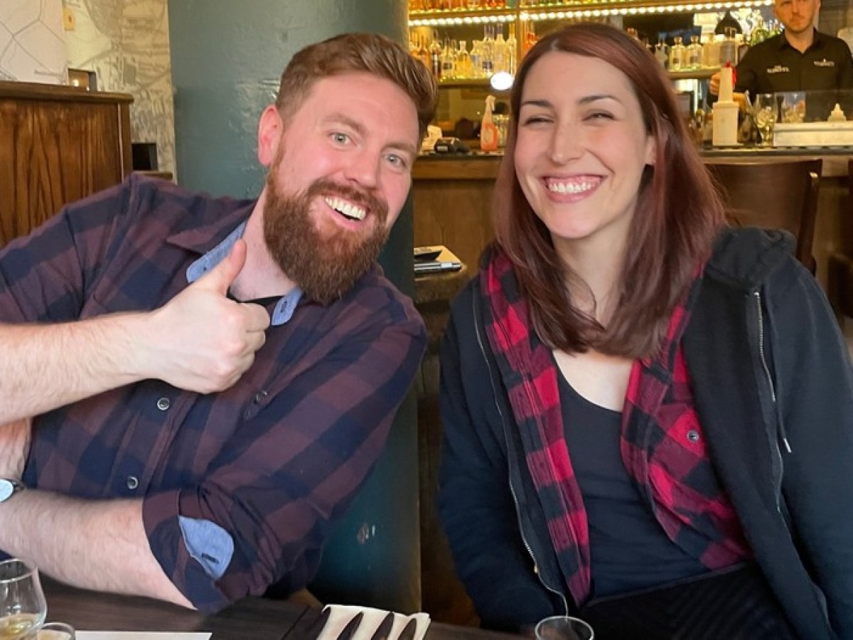 a man and a woman sitting at a table in a restaurant